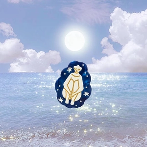 Detailed view of the mermaid acetate hair claw clip featuring a dreamy planet theme