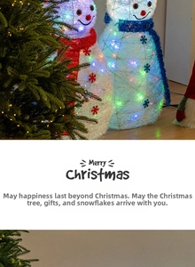 Detail of glowing LED snowman and Christmas tree decorations with warm festive lighting