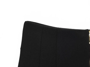 Détail de pantalon taille haute avec fermeture éclair métallique et texture de tissu