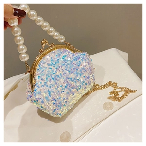 Detailed close-up of a white sequin shell bag featuring a pearl handle and gold chain strap