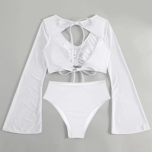 Flat lay of white two-piece swimsuit with long mesh sleeves and high-waisted bottoms
