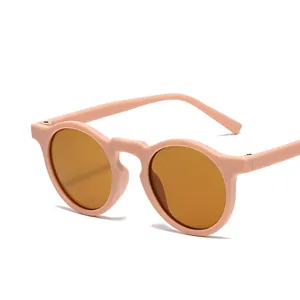 Occhiali da sole rotondi opachi rosa per bambini con lenti color ambra retrò