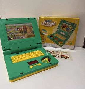 Detail view of cartoon toy laptop set with green mouse and educational puzzle screen