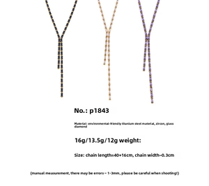 Détail de colliers longs en Y en acier titane avec zircons cubiques multicolores
