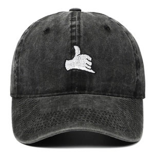 Detail of white gesture embroidery on vintage black washed cotton baseball cap