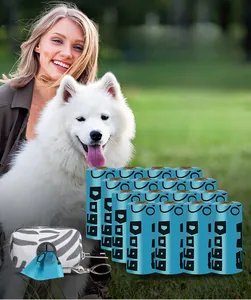 Eco-friendly blue pet waste bags with a patterned zipper pouch on park grass