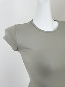 Detailed close-up of grey slim-fit crew neck T-shirt on a mannequin showing fabric texture