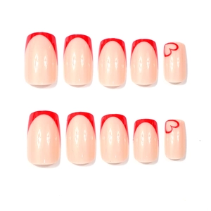Detailed set of 10 red French heart nails with nude pink base and glossy finish