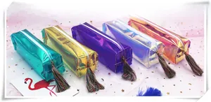 Close-up of five laser iridescent pencil cases with colorful decorative tassels