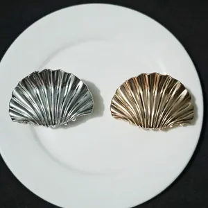 Elegant large metal shell hair claws in polished gold and silver finishes for women