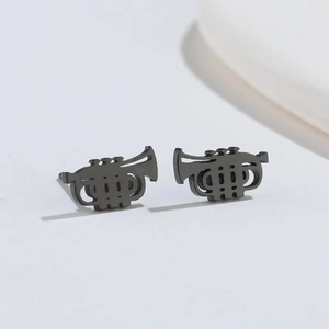 Macro shot of minimalist matte black trumpet shaped stud earrings in stainless steel