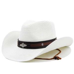 Detailed view of white woven cowboy hat with leather band, metal emblem and chin strap