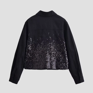 Back view of black sequined lapel jacket featuring long sleeves and sparkling details