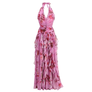 Detail of pink floral halter dress showing ruffled layers and realistic rose patterns