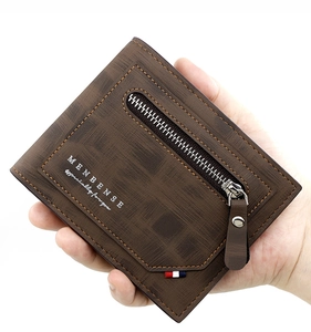 Close-up of brown textured faux leather wallet featuring a stylish metal zipper detail