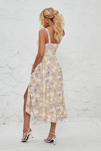 Detail view of the floral print sleeveless midi dress with a side slit and thin straps