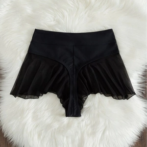 Sexy black high-waisted bikini bottom with mesh ruffle skirt detail on white fur background