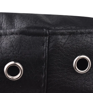 Detailed macro view of black PU leather texture with silver metal eyelets and stitching