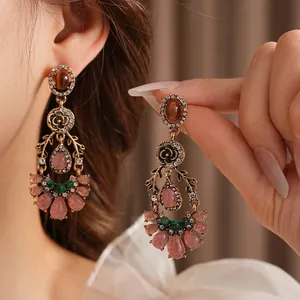 Vintage gold drop earrings with floral design and teardrop gemstones for women