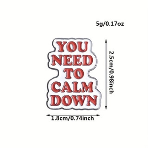 Detailed view of YOU NEED TO CALM DOWN enamel pin with 2.5cm height and 1.8cm width specs