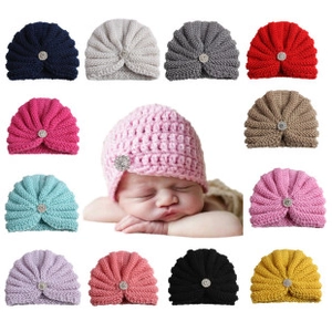 Collection of colorful knitted baby turban hats in twelve vibrant candy shades for toddlers
