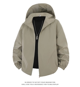 Close-up of khaki hooded windbreaker featuring a full zipper and elastic cuffs detail