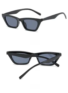 Detail view of black vintage cat-eye sunglasses from side and back angles on white background