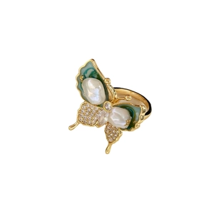 Golden butterfly open ring featuring baroque pearls with green enamel and pavé crystals