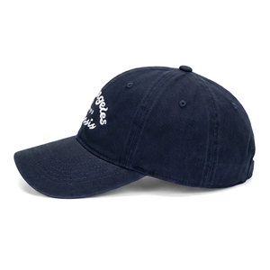 Detail view of navy cotton baseball cap with white Angeles embroidery on the side