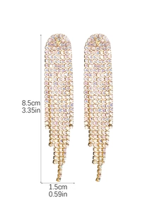 Detail view of luxury gold tassel earrings with colorful rhinestones and size labels