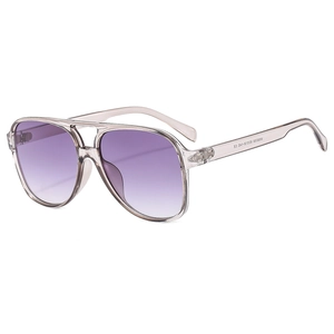 Classic pilot sunglasses with purple gradient lenses and transparent grey frames on white backdrop