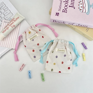 Pochette de rangement en coton à pois colorés avec cordons de serrage aux tons pastel