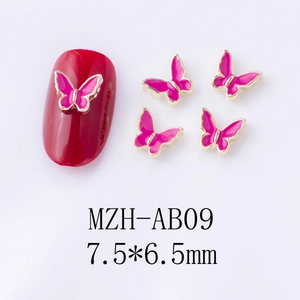 Macro view of hot pink enamel alloy butterfly nail charms with golden metal edges