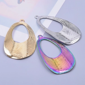 Detailed view of water ripple teardrop pendants in gold, silver and colorful finishes