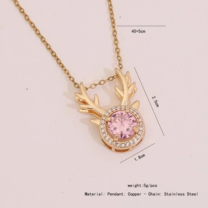 Detail of golden reindeer antler necklace with pink crystal and dimension labels