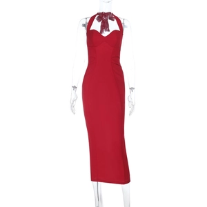 Detail view of the red halter neckline and pleated chest design on a bodycon dress
