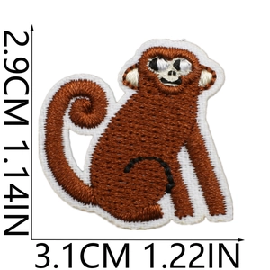 Detailed close-up of brown monkey embroidery patch showing dimensions 3.1cm by 2.9cm