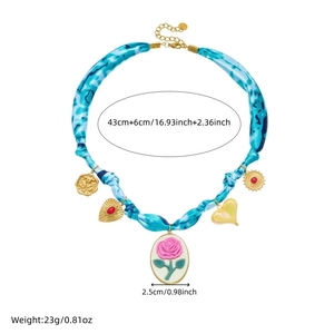 Vintage gold-plated stainless steel necklace with blue fabric chain and floral pendant