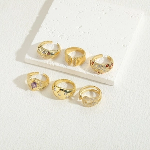 Detail view of six 14K gold plated rings with colorful gemstones and zircon accents