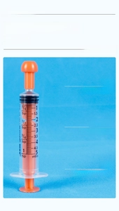 Detail view of 5ml oral syringe with orange plunger and dual-scale markings