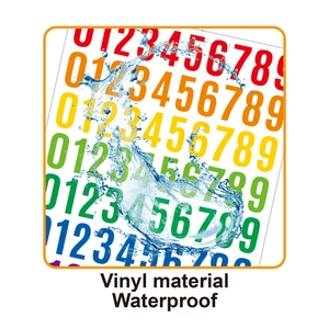 Close-up of waterproof vinyl number stickers with water splashes showing durability