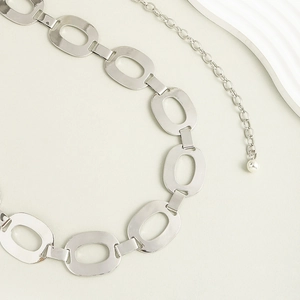 Silver metal waist chain featuring polished oval links and a dainty beaded extender chain