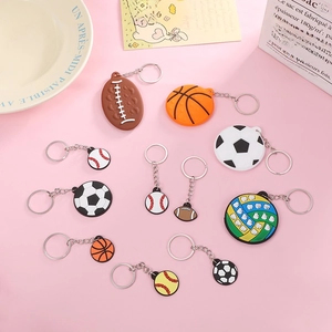 Colorful PVC sports ball keychains including basketball, football, and rugby styles