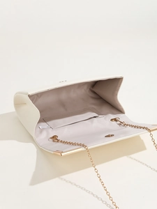 Detail view of white PU leather envelope clutch with gold chain strap and interior pocket