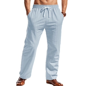 Close-up of light blue striped linen trousers with adjustable drawstring elastic waistband