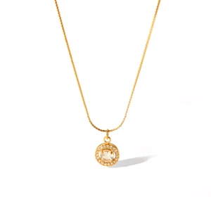 Close-up of 18K gold stainless steel necklace with round sparkling diamond pendant