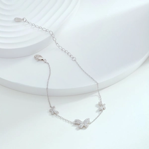 Detailed view of S925 sterling silver butterfly bracelet with sparkling zircon charms