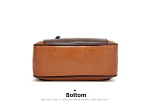 Close-up of bottom detail on brown pebble leather backpack with neat stitching