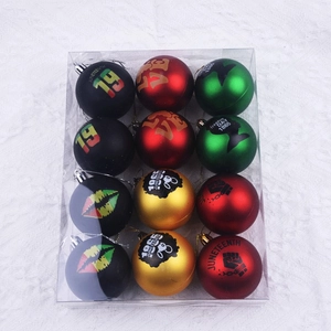 Set of 12 Juneteenth decorative balls featuring black red green and gold patterns in a box