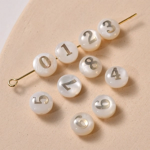White freshwater shell beads with golden numbers for DIY jewelry making in vintage style